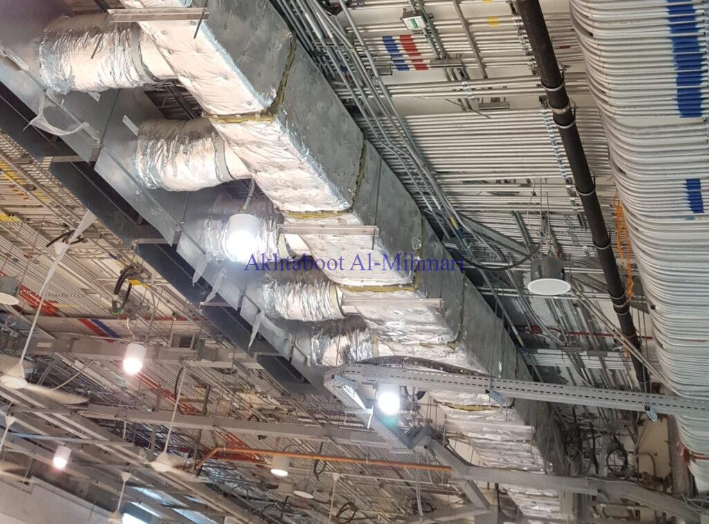 alliuminum pipes are installed at the celling for Electrical wiring: Building Electrical Systems Done Right: Choose Akhtaboot Al Mihmari, your trusted contractor for electrical works.