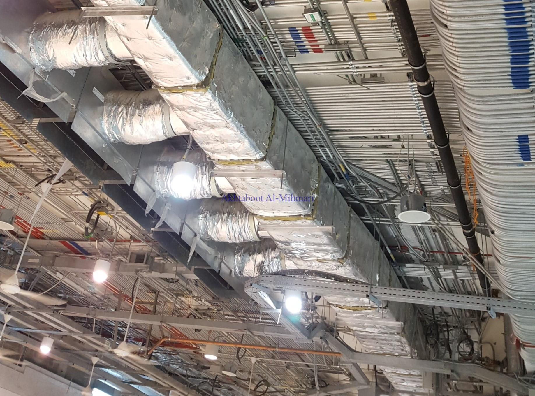 alliuminum pipes are installed at the celling for Electrical wiring: Building Electrical Systems Done Right: Choose Akhtaboot Al Mihmari, your trusted contractor for electrical works.